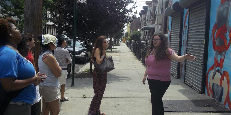 Ariel presents "Truth be Sold" to fellow Hope Reichbach Memorial Fund interns at one of Groundswell's bus tours.